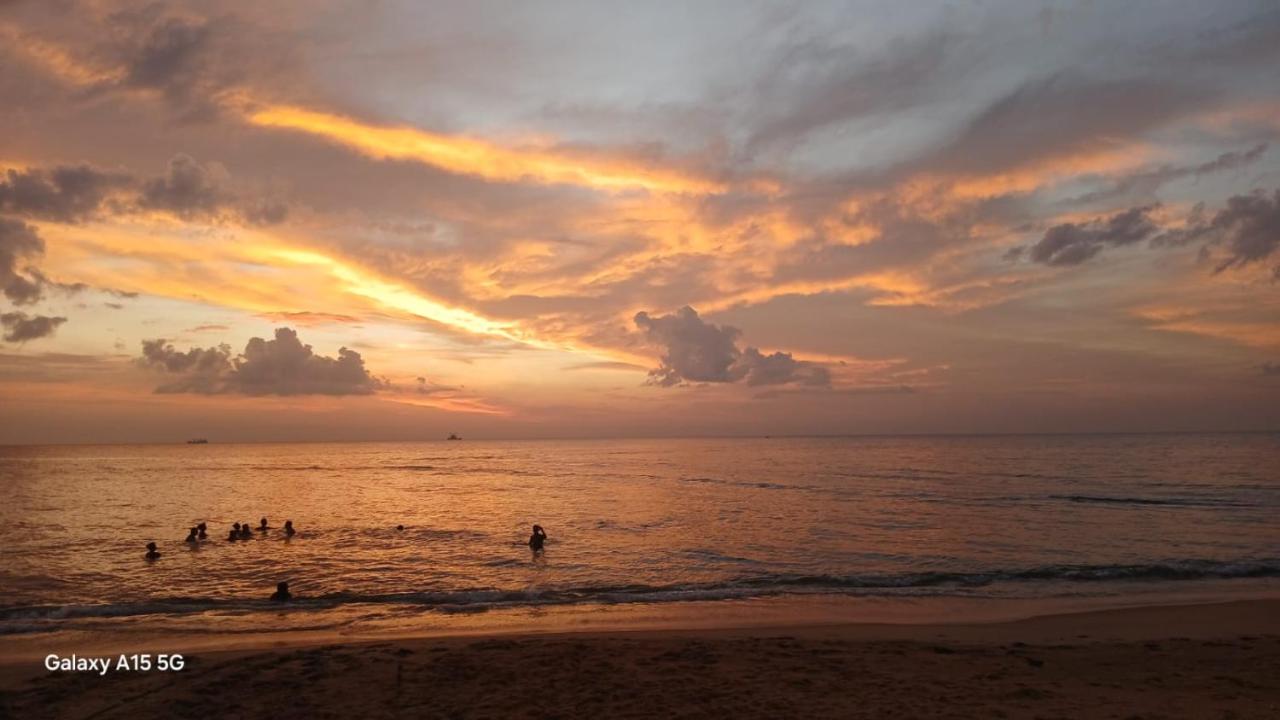 Guests in the ocean at sunset enjoying Kalpitiya waters
